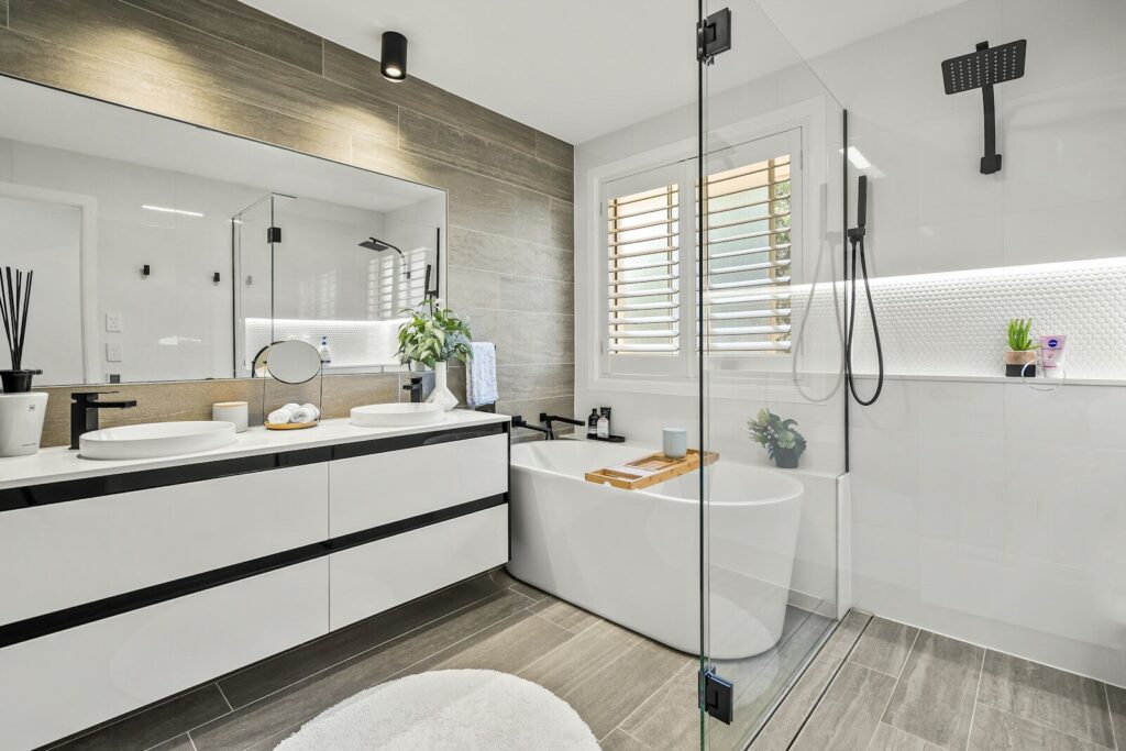 Luxurious modern bathroom with double vanity and freestanding bathtub