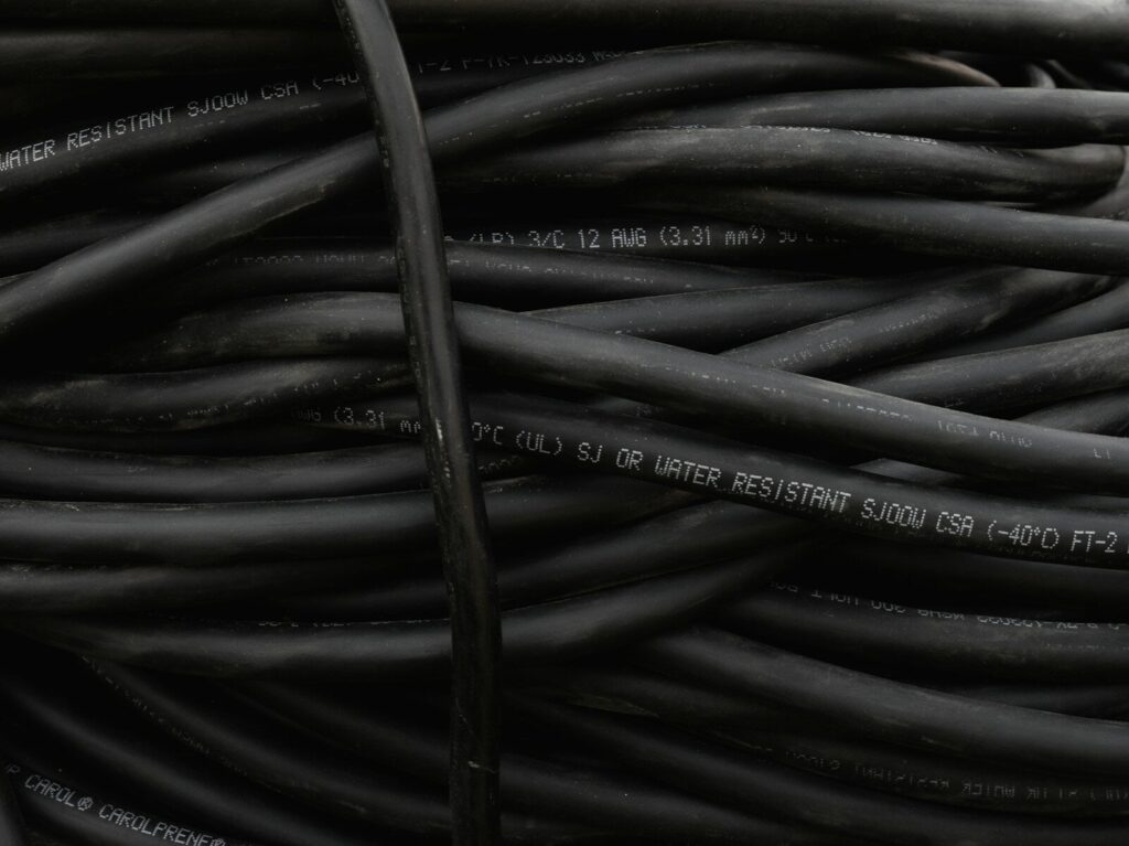 a bunch of black wires are stacked together